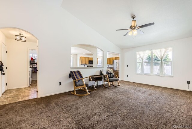 5770 Waverley Ave, Firestone, CO 80504 - living area with ceiling fan, carpet flooring, arched walkways, and lofted ceiling