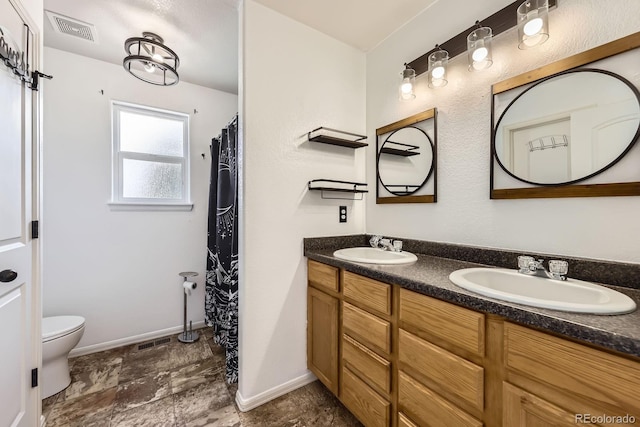 5770 Waverley Ave, Firestone, CO 80504 - full bathroom featuring double vanity and stone finish floors