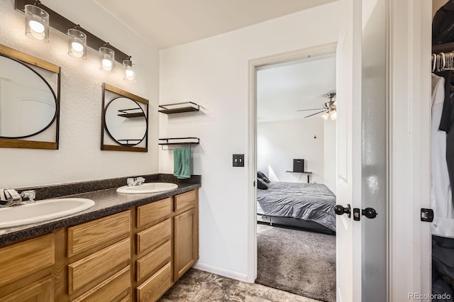 5770 Waverley Ave, Firestone, CO 80504 - ensuite bathroom featuring double vanity and ceiling fan