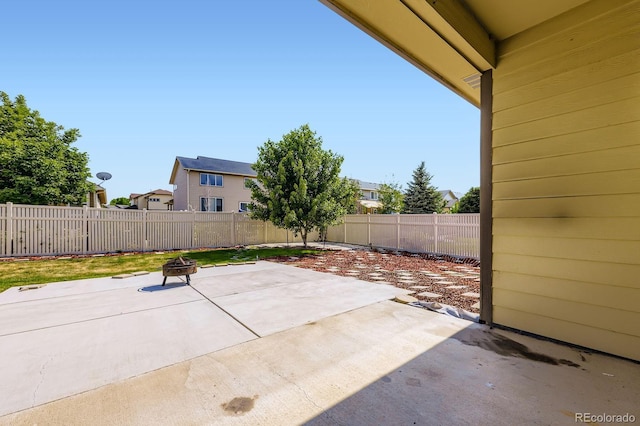 5770 Waverley Ave, Firestone, CO 80504 - fenced backyard with a patio and a fire pit