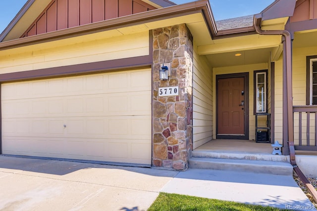 5770 Waverley Ave, Firestone, CO 80504 - entrance to property featuring stone siding, board and batten siding, a garage, and concrete driveway