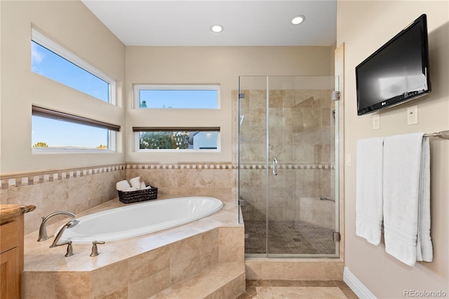 bathroom featuring vanity and plus walk in shower