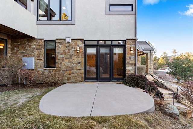 doorway to property featuring a patio and french doors