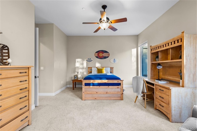 bedroom featuring ceiling fan and light colored carpet