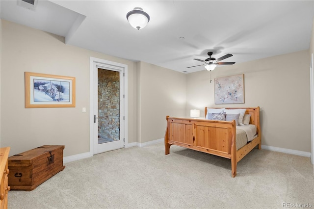 bedroom featuring light carpet, ceiling fan, and access to exterior