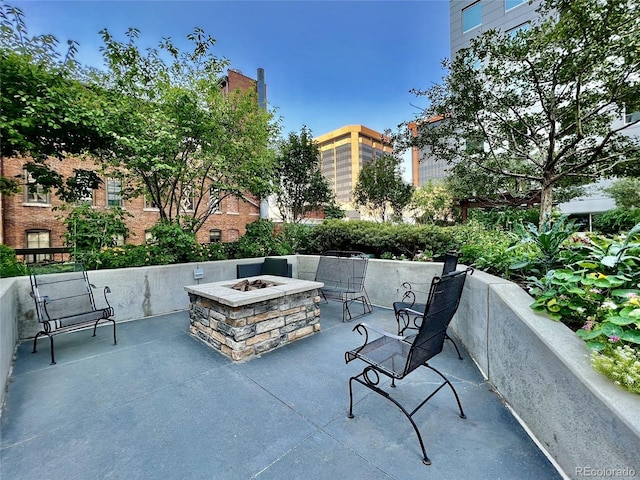 view of patio / terrace featuring an outdoor fire pit