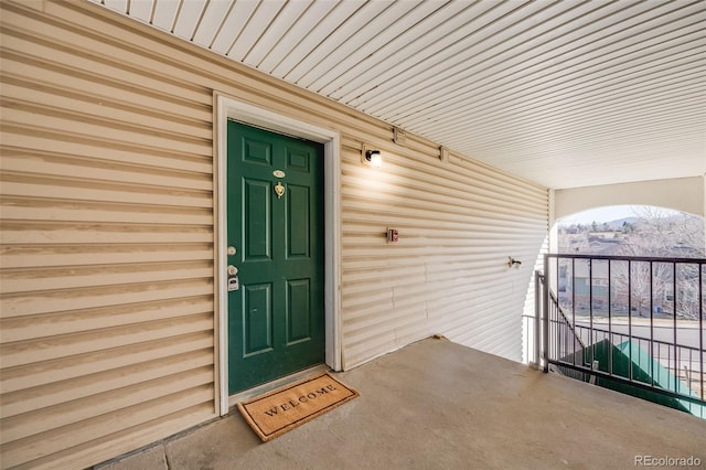 entrance to property with a balcony