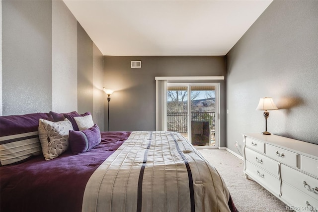 bedroom with visible vents, carpet flooring, baseboards, and access to outside