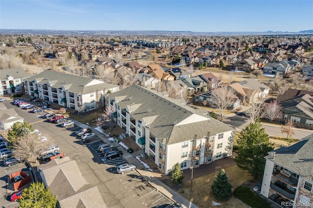 birds eye view of property with a residential view