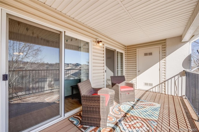 wooden deck with visible vents