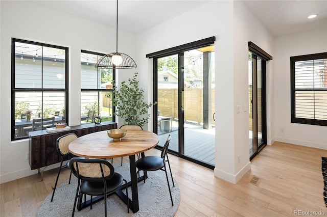 3149 W 35th Ave, Denver, CO 80211 - dining space featuring light wood-type flooring, healthy amount of natural light, and recessed lighting