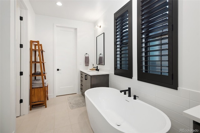 3149 W 35th Ave, Denver, CO 80211 - full bath with a freestanding tub, vanity, tile walls, tile patterned flooring, and recessed lighting