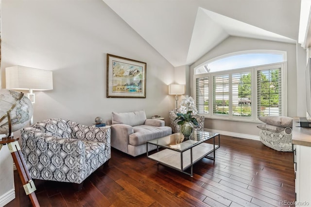 living room featuring dark hardwood / wood-style flooring and high vaulted ceiling