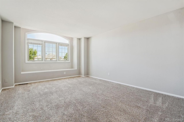 unfurnished room with carpet flooring