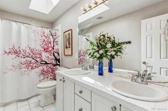 bathroom with tile patterned flooring, vanity, toilet, and a shower with shower curtain