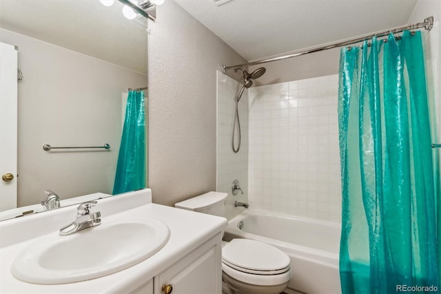 full bathroom with a textured ceiling, shower / tub combo, vanity, and toilet