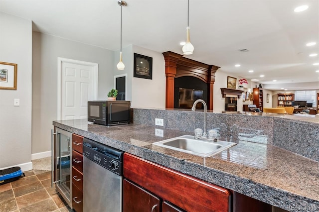 kitchen with stainless steel dishwasher, sink, wine cooler, and decorative light fixtures