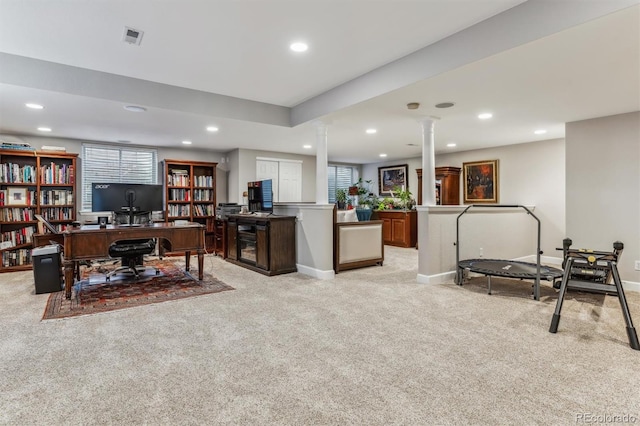 carpeted home office featuring ornate columns