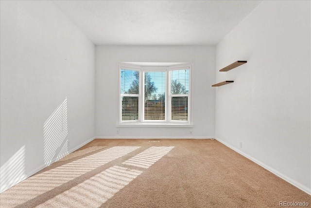 3300 W 2nd Ave, Denver, CO 80219 - unfurnished room featuring light colored carpet and baseboards