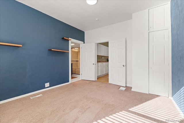 3300 W 2nd Ave, Denver, CO 80219 - unfurnished bedroom featuring carpet floors and ensuite bath