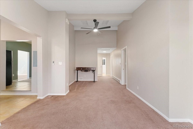 3300 W 2nd Ave, Denver, CO 80219 - corridor with carpet floors, a high ceiling, and tile patterned floors