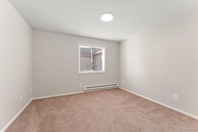 3300 W 2nd Ave, Denver, CO 80219 - carpeted empty room with a baseboard heating unit and baseboards