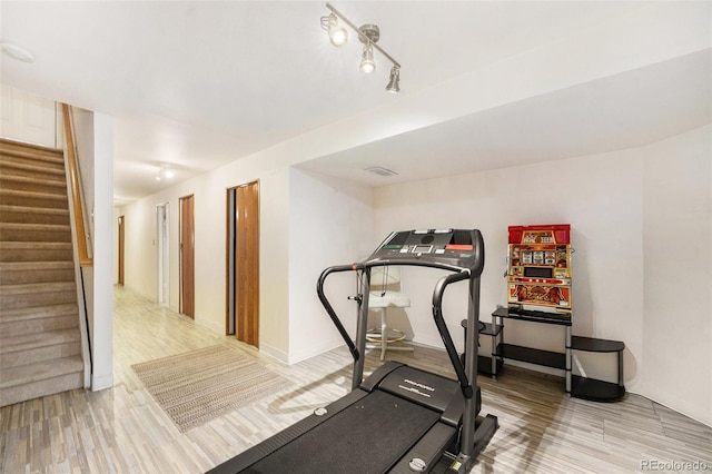 workout room featuring wood-type flooring