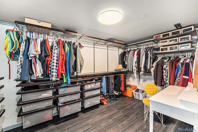 spacious closet with wood finish floors