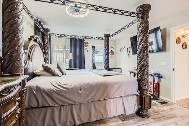 bedroom with wood-type flooring