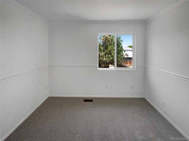 12550 Eastlake Dr, Thornton, CO 80241 - spare room featuring carpet flooring, ornamental molding, and baseboards