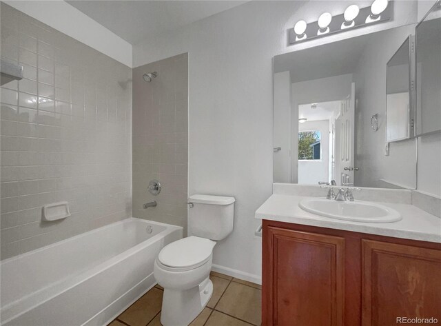 12550 Eastlake Dr, Thornton, CO 80241 - full bathroom featuring tile patterned flooring, vanity, bathtub / shower combination, toilet, and baseboards