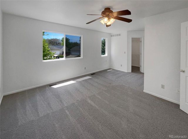 12550 Eastlake Dr, Thornton, CO 80241 - spare room featuring healthy amount of natural light, carpet floors, ceiling fan, and baseboards