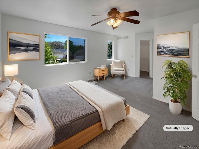 12550 Eastlake Dr, Thornton, CO 80241 - carpeted bedroom featuring multiple windows, ceiling fan, and baseboards