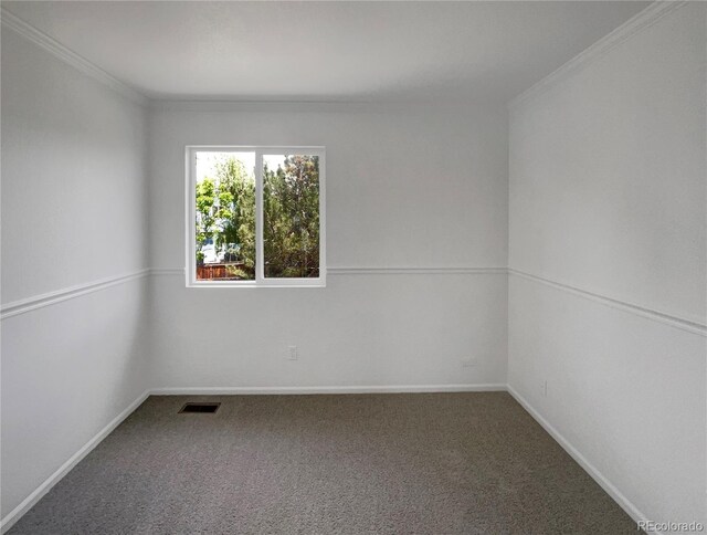 12550 Eastlake Dr, Thornton, CO 80241 - spare room with crown molding, carpet, and baseboards