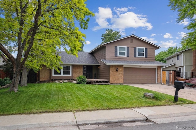 8268 W Caley Pl, Littleton, CO 80123 - view of front of house featuring an attached garage, brick siding, driveway, and a shingled roof