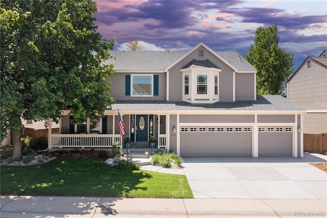 1774 Spring Water Pl, Highlands Ranch, CO 80129 - view of front facade with covered porch, concrete driveway, roof with shingles, and a garage
