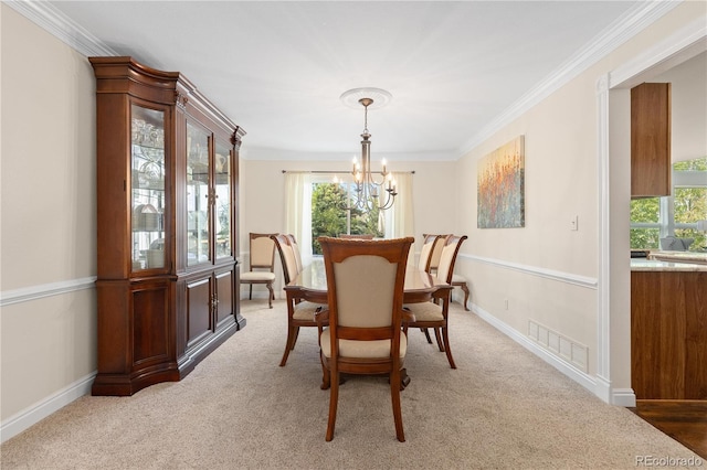 1774 Spring Water Pl, Highlands Ranch, CO 80129 - dining room with a chandelier, light colored carpet, ornamental molding, and baseboards