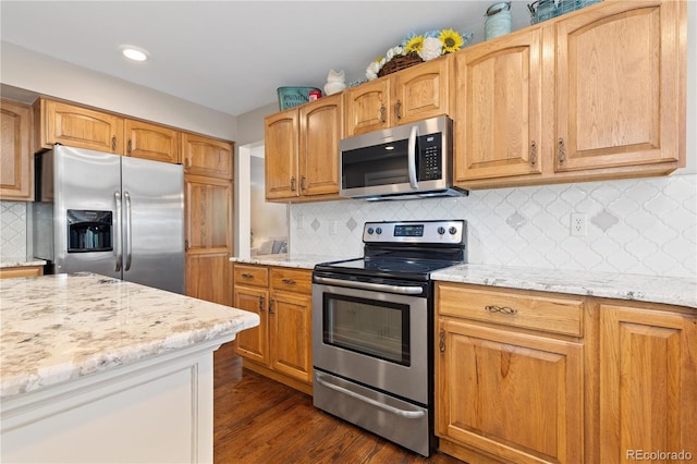 1774 Spring Water Pl, Highlands Ranch, CO 80129 - kitchen featuring appliances with stainless steel finishes, light stone counters, decorative backsplash, dark wood-style flooring, and recessed lighting
