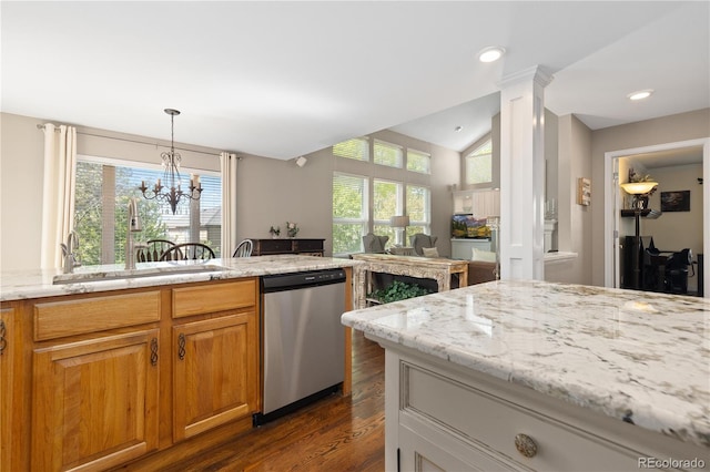 1774 Spring Water Pl, Highlands Ranch, CO 80129 - kitchen featuring dishwasher, a sink, dark wood-style floors, plenty of natural light, and vaulted ceiling