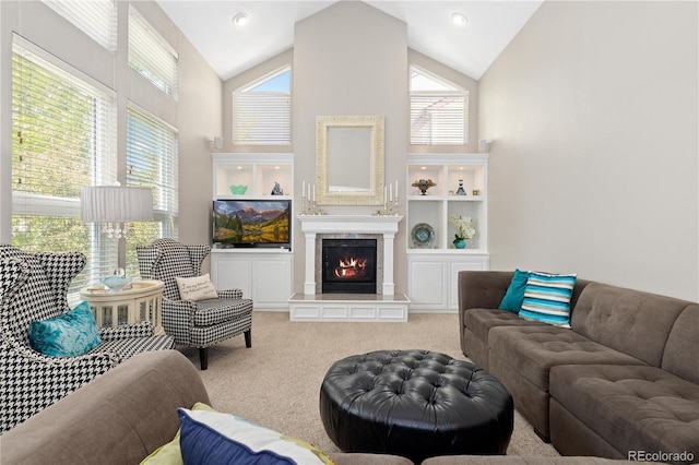 1774 Spring Water Pl, Highlands Ranch, CO 80129 - living room featuring carpet floors, a glass covered fireplace, and high vaulted ceiling