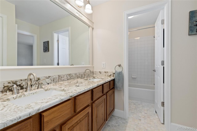1774 Spring Water Pl, Highlands Ranch, CO 80129 - bathroom with double vanity, baseboards, and shower / bathtub combination