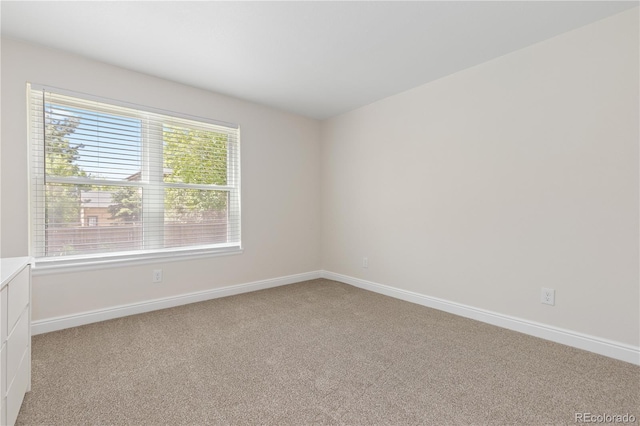 1774 Spring Water Pl, Highlands Ranch, CO 80129 - spare room with light colored carpet and baseboards