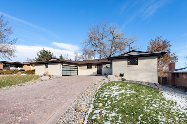 ranch-style home featuring a garage