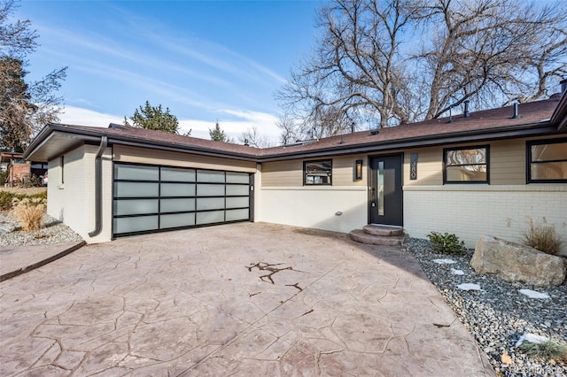 ranch-style house featuring a garage