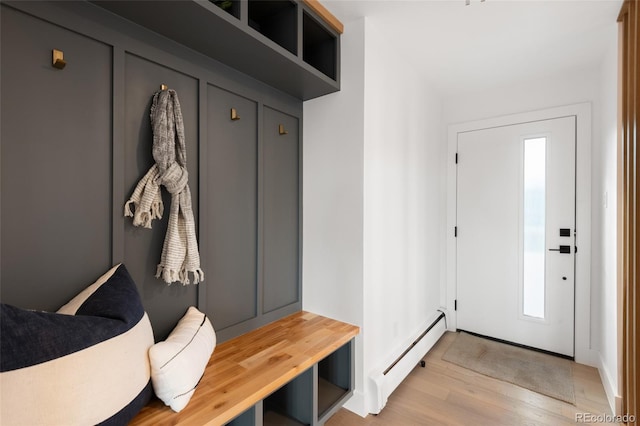 mudroom with light hardwood / wood-style floors and a baseboard radiator