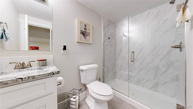 1741 W 55th Pl, Denver, CO 80221 - full bathroom with vanity, a shower stall, and a textured wall