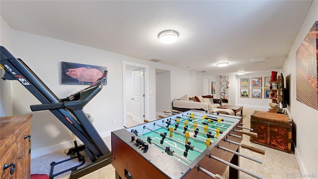 1741 W 55th Pl, Denver, CO 80221 - recreation room featuring baseboards and a textured ceiling