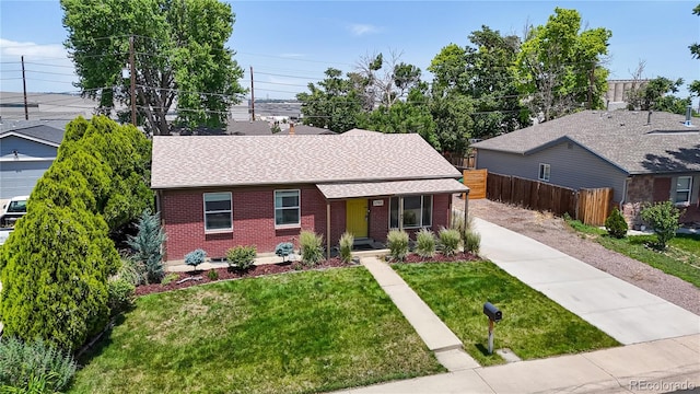 1741 W 55th Pl, Denver, CO 80221 - ranch-style house featuring brick siding, a shingled roof, and driveway