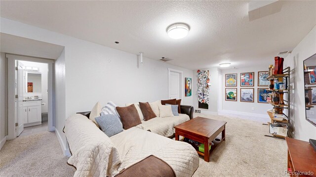 1741 W 55th Pl, Denver, CO 80221 - living area featuring light colored carpet and a textured ceiling