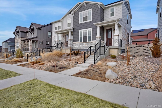 view of front of property with stone siding and a residential view